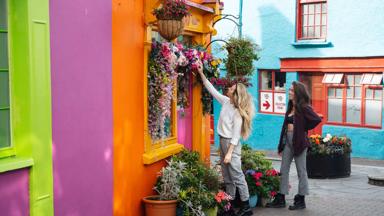 couple paying a visit to the colourful shops of Kinsale Co Cork