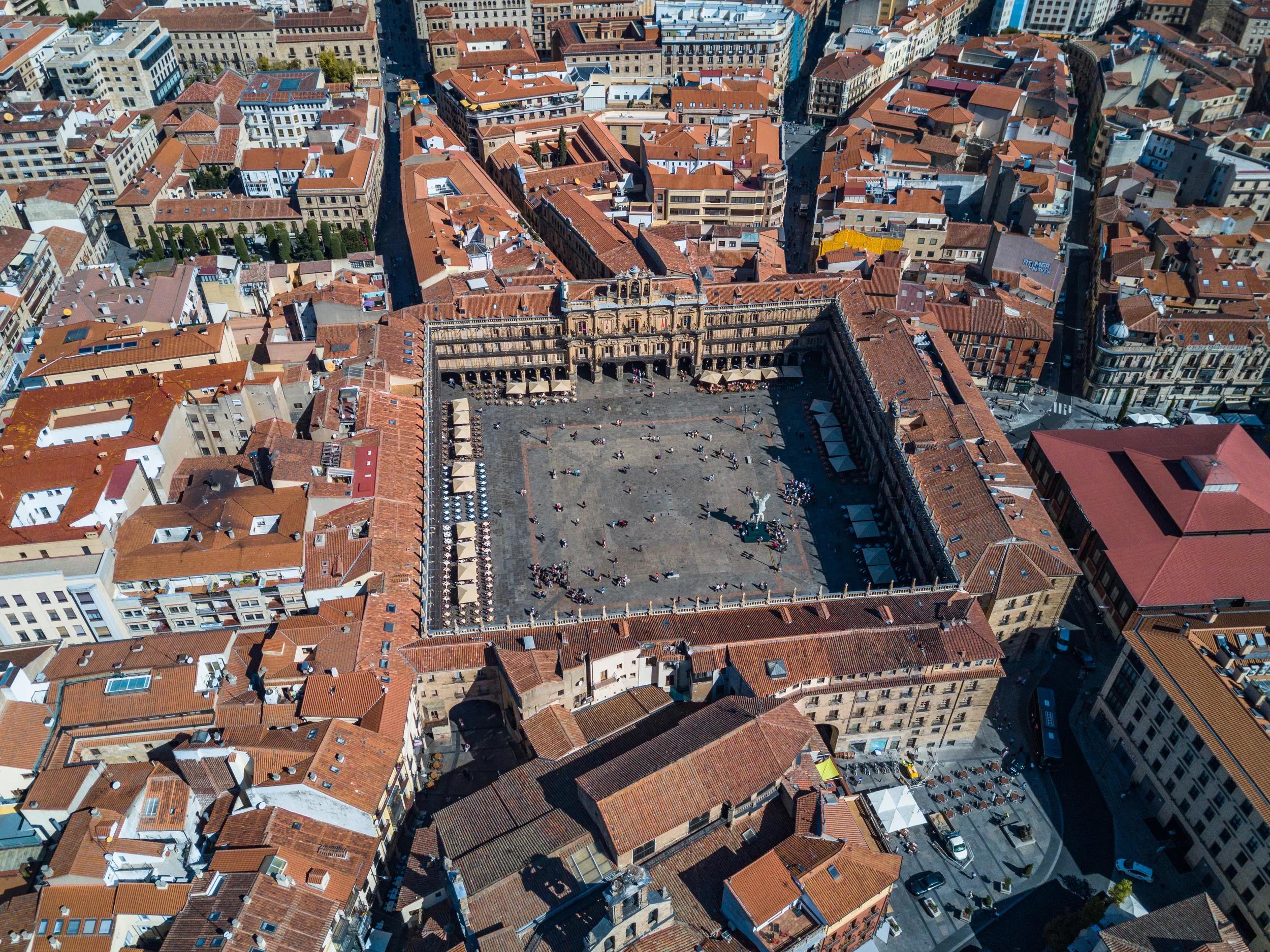 The Plaza Mayor (English Main Square) was built during Philip III's reign (1598–1621) and is a central plaza in the city of Madrid, Spain. It is located only a few Spanish blocks away from another famous plaza, the Puerta del Sol. The Plaza Mayor is rectangular in shape, measuring 129 m × 94 m (423 ft × 308 ft), and is surrounded by three-story residential buildings having 237 balconies facing the Plaza. It has a total of nine entrance ways. The Casa de la Panadería (Bakery House), serving municipal and cultural functions, dominates the Plaza Mayor.