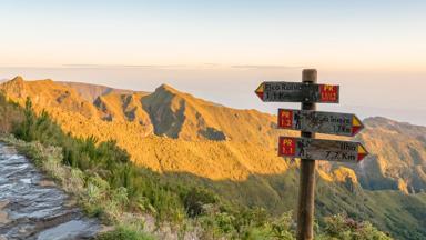 Trail signpost on the track to Pico Ruivo in spring. Achada do Teixeira, Santana municipality, Madeira region, Portugal.