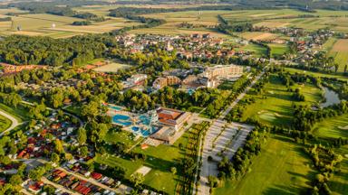 Aerial view of Moravske Toplice with trees and agricultural field
