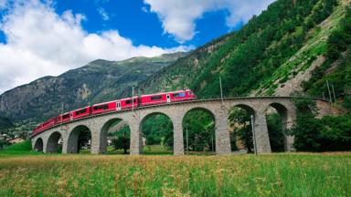 Swiss mountain train Bernina Express Cross the bridge in the circle to gain altitude in the summer