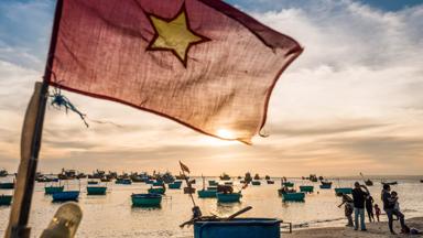 Phan Thiet, Vietnam, November 2016. Fishermen prepare for the catch of the day on the beach of Phan Thiet, which is the largest fish sauce producer of Vietnam. Phan Thiet is a quiet beach resort town on the South China sea. Vietnam is a popular Asian travel destination for tourists and travelers. Photo by Frits Meyst / MeystPhoto.com