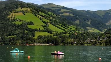 View from Zell am See in Austria to the lake with watersport activities
