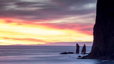 Cliffs of Risin og Kellingin at sunrise seen from Tjornuvik, Streymoy Island, Faroe Islands