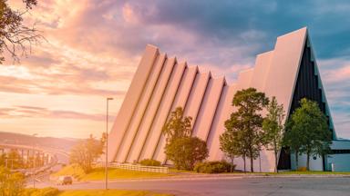 Arctic cathedral in Tromso, Norway, Scandinavia, Europe. Cloudy sunset sky in background. Architecture and religion.