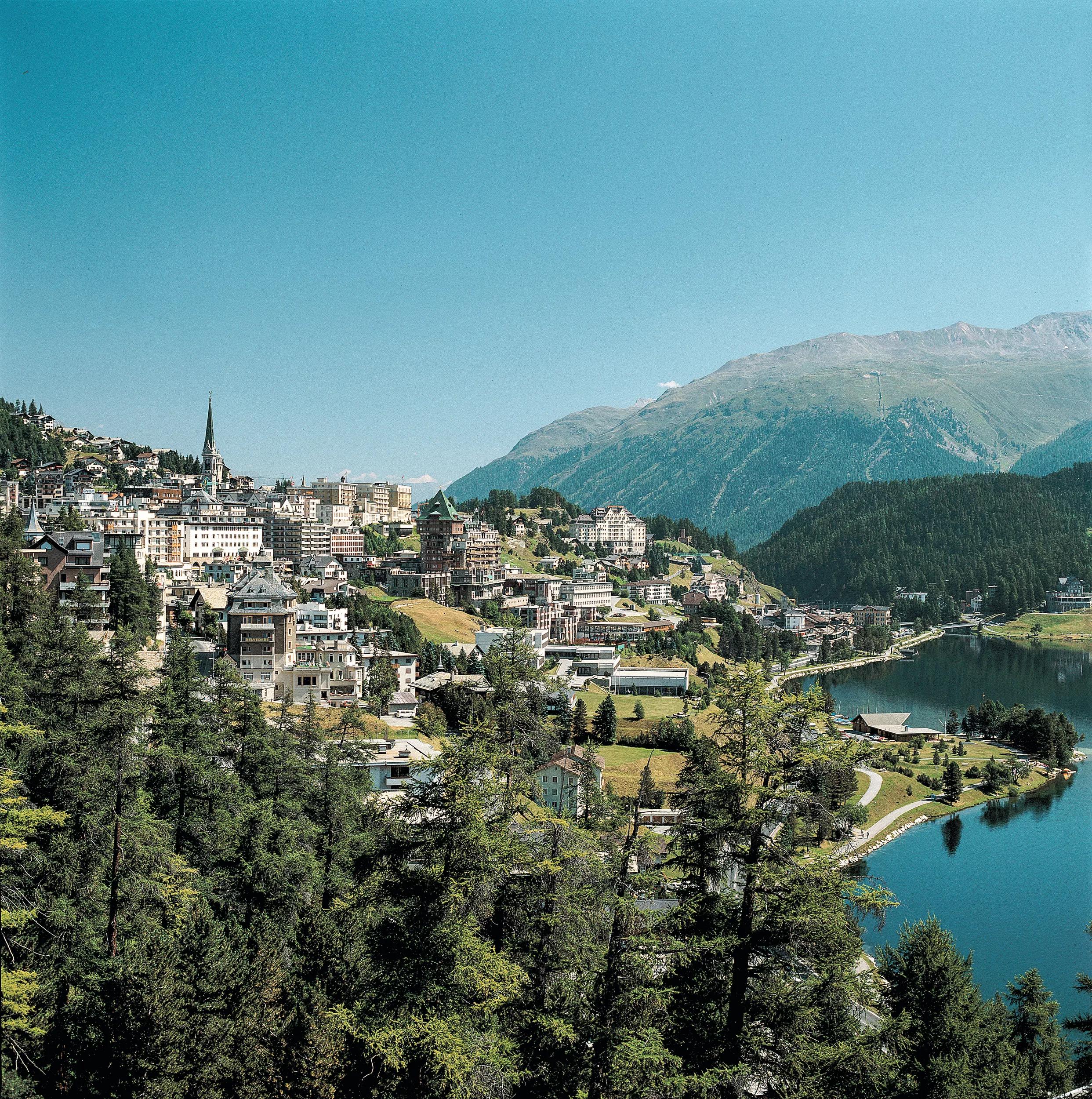 Creation Date: 09/07/2003.Reference: STS0169.Title: SWITZERLAND.GET NATURAL..Caption: Switzerland. get natural..St. Moritz (1822 m) in the Upper Engadin, Graubuenden. View onto St. Moritz and its lake. In the backgroud Muottas Muragl, a panoramic excursion goal...Schweiz. ganz natuerlich..St. Moritz (1822 m) im Oberengadin, Graubuenden. Blick ueber St. Moritz-Dorf auf den See. Im Hintergrund der Aussichtsberg Muottas Muragl...Suisse. tout naturellement..St-Moritz (1822 m) en Haute-Engadine, Grisons. Vue sur le lac et St-Moritz-Dorf. Au fond, la montagne panoramique de Muottas Muragl...Copyright by Switzerland Tourism By-line:.swiss-image.ch/Lucia Degonda..Signature: Lucia Degonda.Library: Tourismus_Schweiz.Credit: Switzerland Tourism.Created Date: 20030907