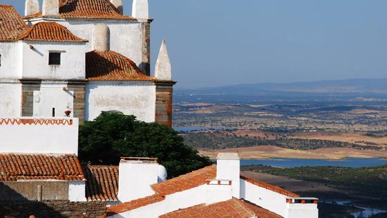 Monsaraz, famous medieval village in Alentejo with river Alqueva at background.