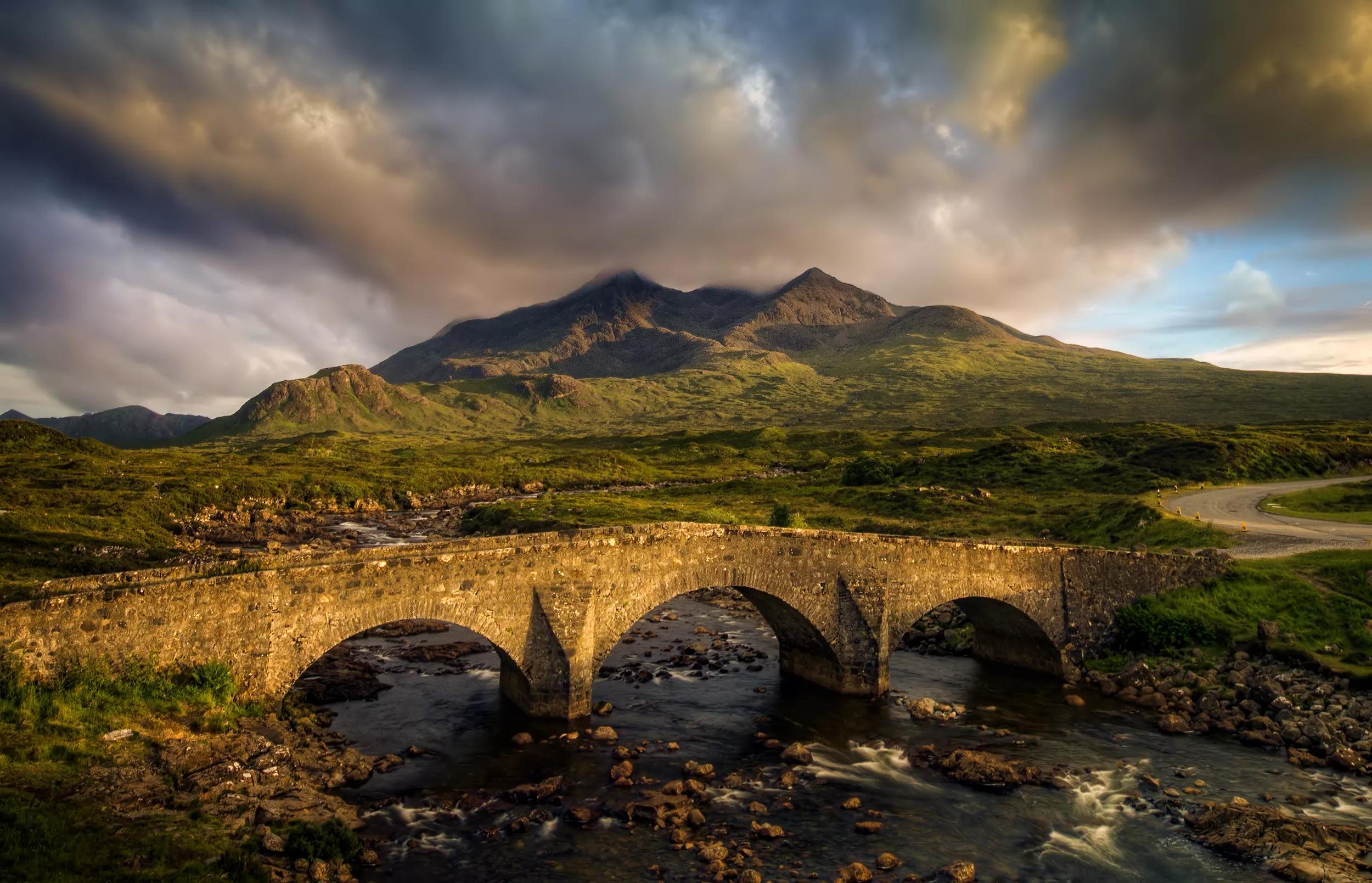 Sligachan Bridge and cloudy Black Cuillins in sunset light, Isle of Skye, Scotland