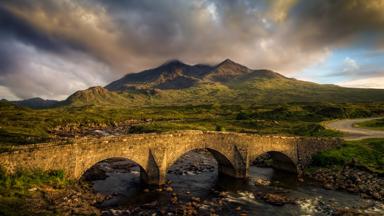 Sligachan Bridge and cloudy Black Cuillins in sunset light, Isle of Skye, Scotland