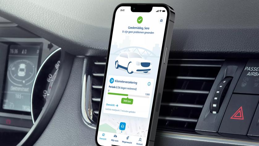 Foto van telefoon waarop de Smart Driver app te zien is.