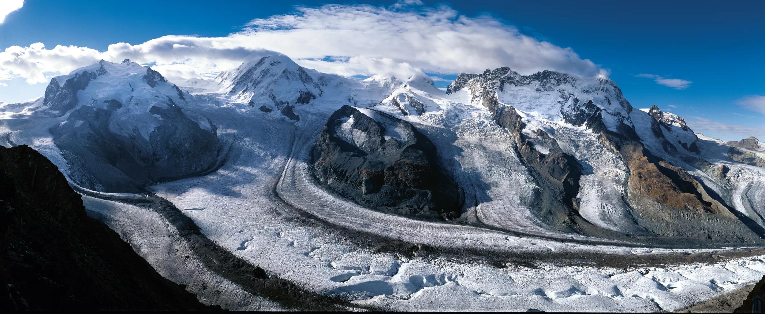 Reference: STS3070.Title: SWITZERLAND - SUMMER.Caption: Switzerland. get natural. .Panorama view from the Gornergrat high above Zermatt, Valais: to the left Monte Rosa with Dufourspitze (4,634 m), in the center Liskamm (4,527 m), to the right Breithorn (4,164 m), in front the Gorner Glacier. ..Schweiz. ganz natuerlich. .Panorama-Aussicht vom Gornergrat oberhalb Zermatt, Wallis: links Monte Rosa mit Dufourspitze (4634 m), mitte Liskamm (4527 m), rechts Breithorn (4164 m), davor der Gornergletscher. ..Suisse. tout naturellement. .Vue panoramique depuis le Gornergrat au-dessud de Zermatt dans le Valais: a gauche, le Mont Rose avec le Dufourspitze (4634 m), au centre, le Liskamm (4,527 m), a droite, le Breithorn (4164 m), au premier plan, le glacier du Gorner. ..Copyright by: Switzerland Tourism By-Line: swiss-image.ch/Marcus Gyger