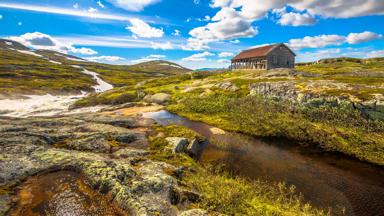 Abandoned house in the wilderness and a fairy-tale landscape by the river. Norway, Geilo between R13 and Eidfjord.